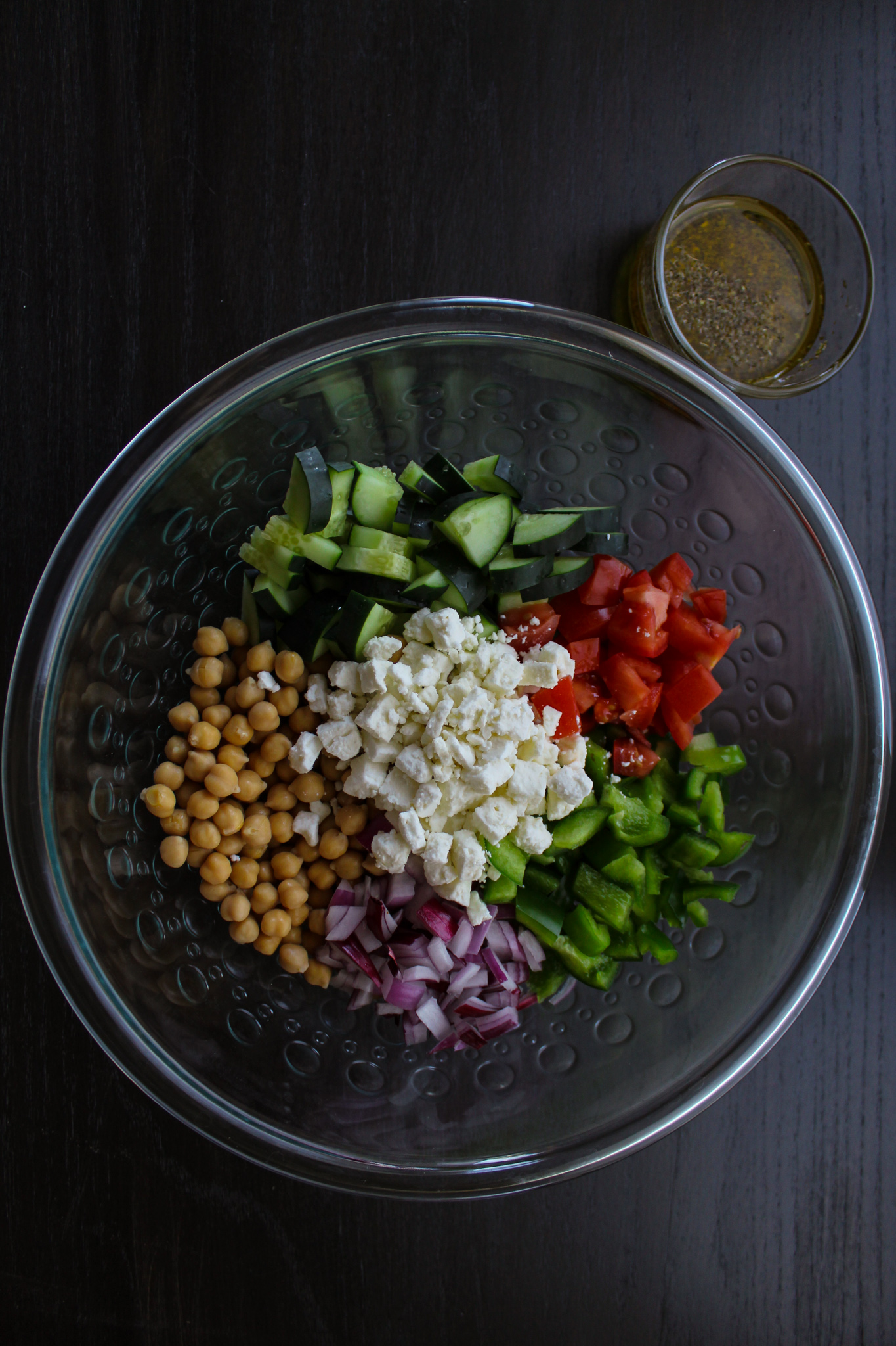 ingredients for Mediterranean chickpea salad in large bowl