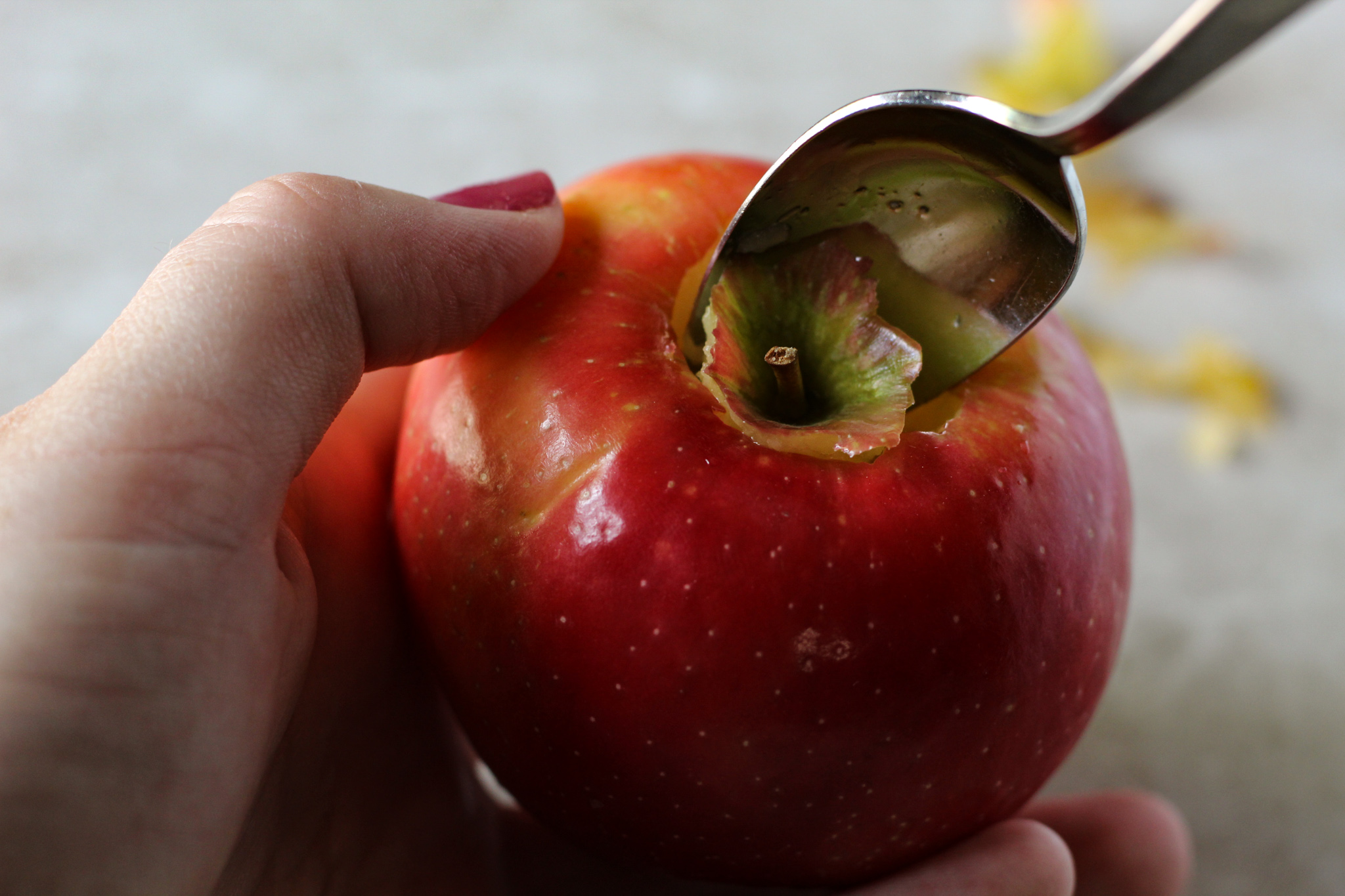 Removing apple core and seeds with a spoon