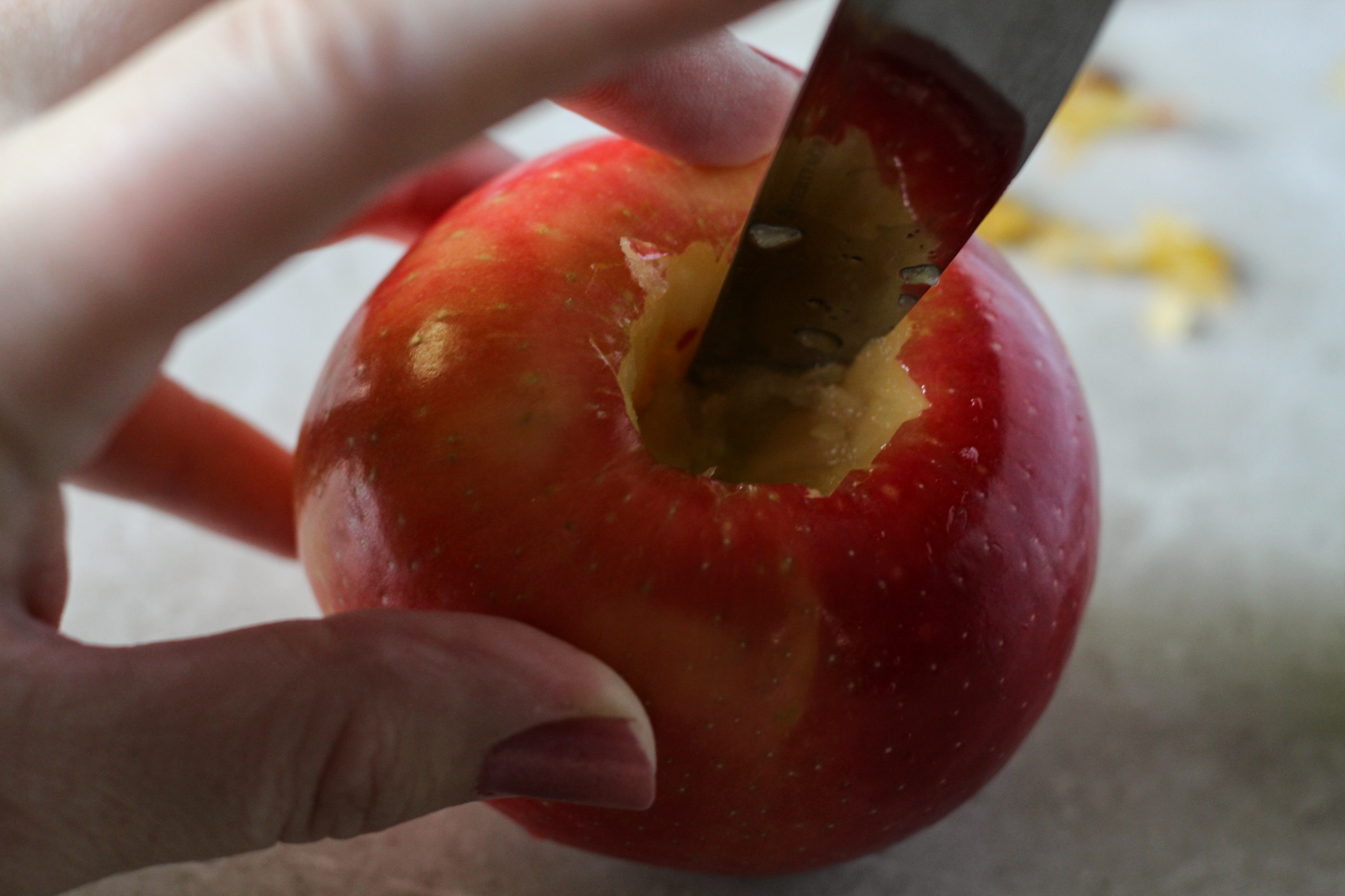 Removing apple core and seeds with a knife